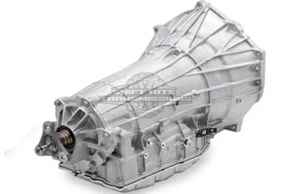 Silver automotive transmission assembly on white background